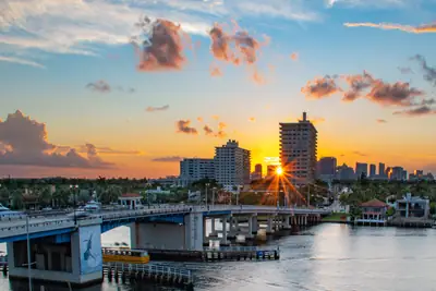 Sunrise over the Las Olas Bridge and the Intracoastal in Fort Lauderdale, with boats at the docks